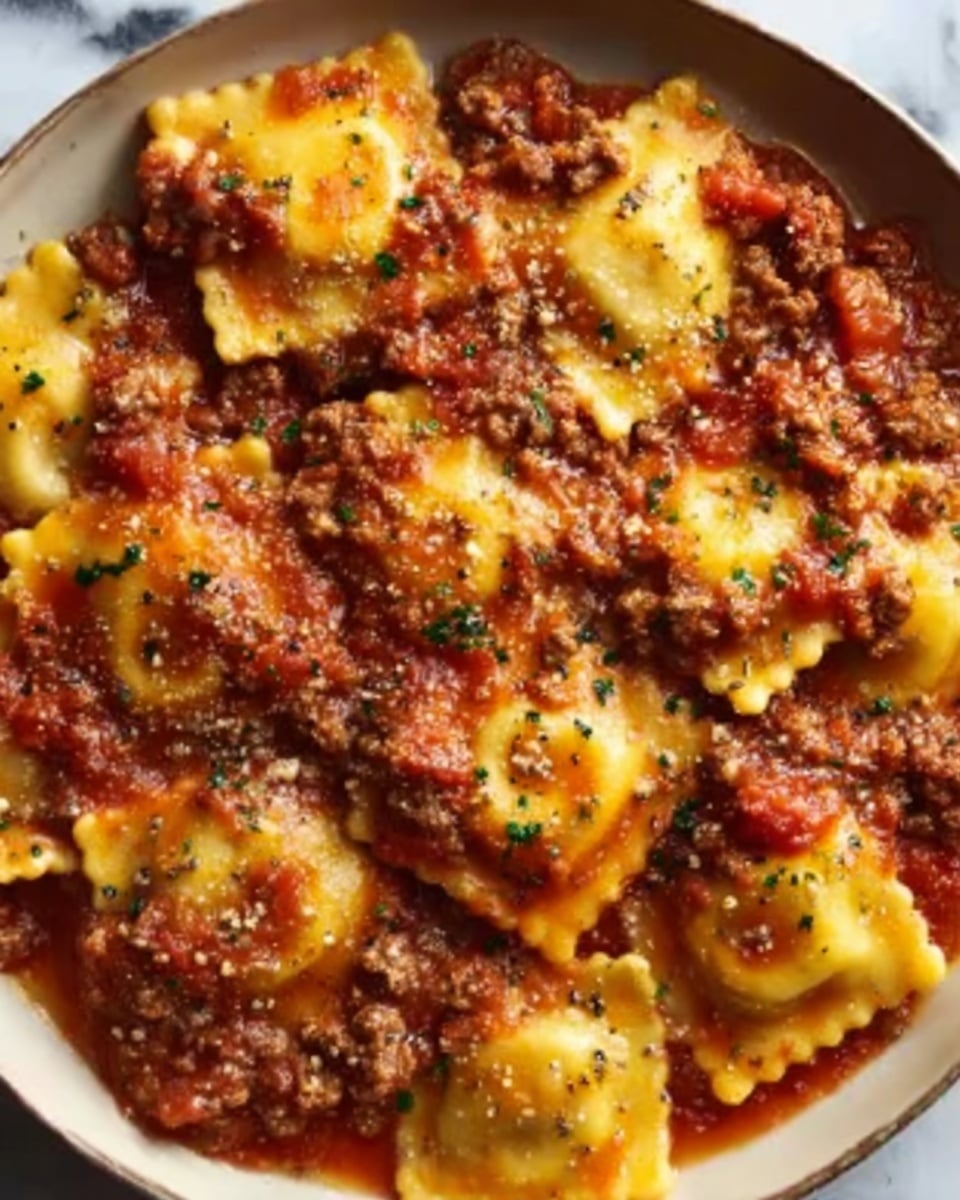 The image shows many small, golden-brown pieces of cooked cauliflower, each with a slightly crispy and textured surface. The cauliflower pieces are coated in a shiny, slightly oily sauce that gives them a warm orange-brown color. They are stacked closely together, filling the whole frame with no other visible items. The background is a white marbled texture. photo taken with an iphone --ar 4:5 --v 7