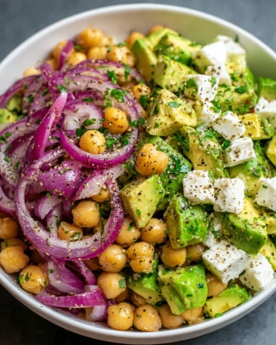 A close-up view of a baked casserole in a clear glass dish, showing a thick yellow and golden top layer of melted cheese mixed with browned sausage pieces and small crispy bits of bacon, sprinkled with green herbs. Below the top layer is a fluffy, pale, creamy inside with visible pockets of white, soft cheese. The edges are golden brown and slightly crispy. A silver spoon lifts a square piece, highlighting the thick, soft, and textured inside. The background is a white marbled texture. photo taken with an iphone --ar 4:5 --v 7